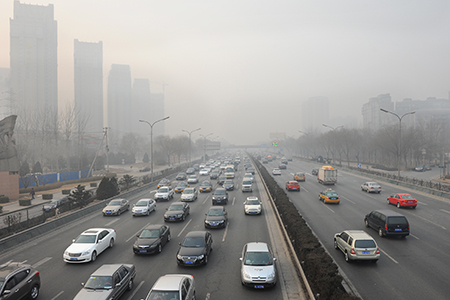 Cars on a foggy road - emissions